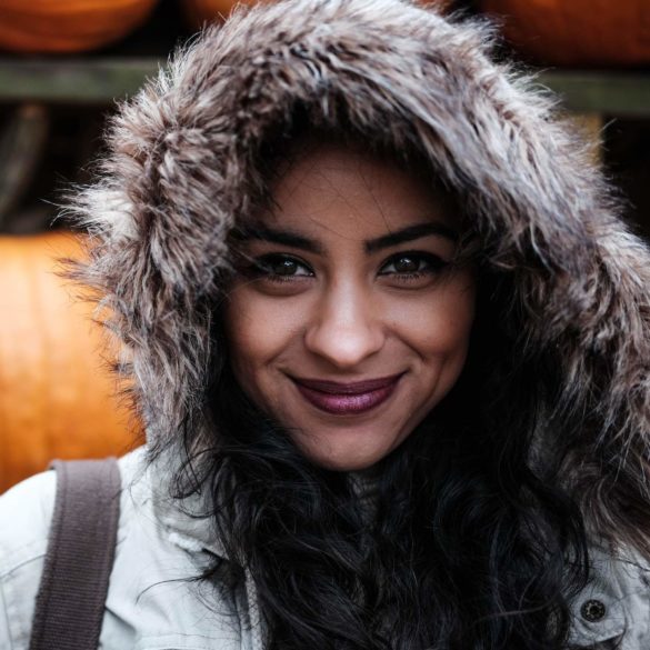 smiling woman with furry hood